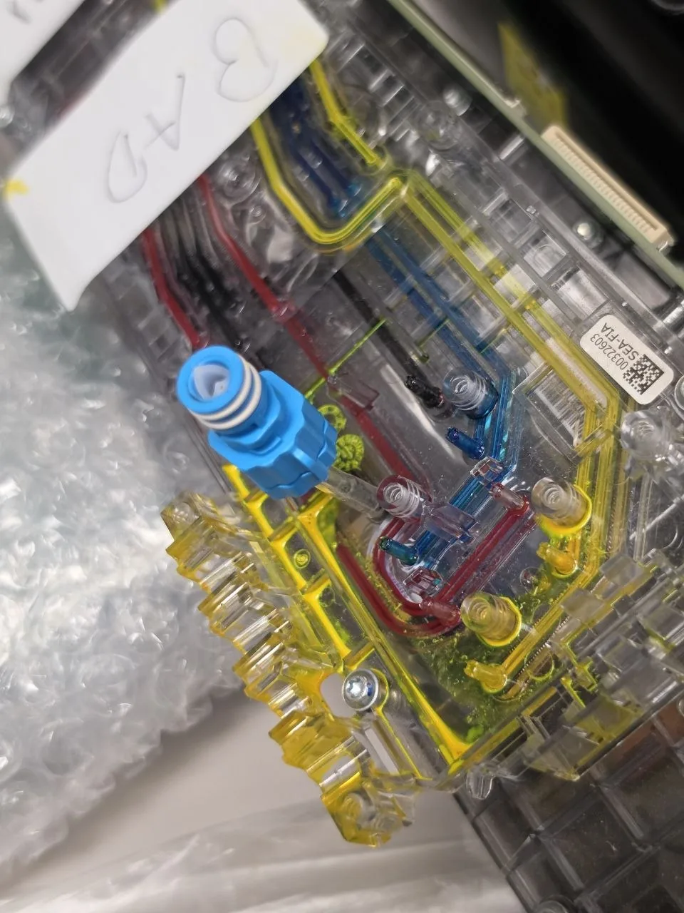 HP FI-1000 printhead assembly on the InkBags service bench during an ink system flush